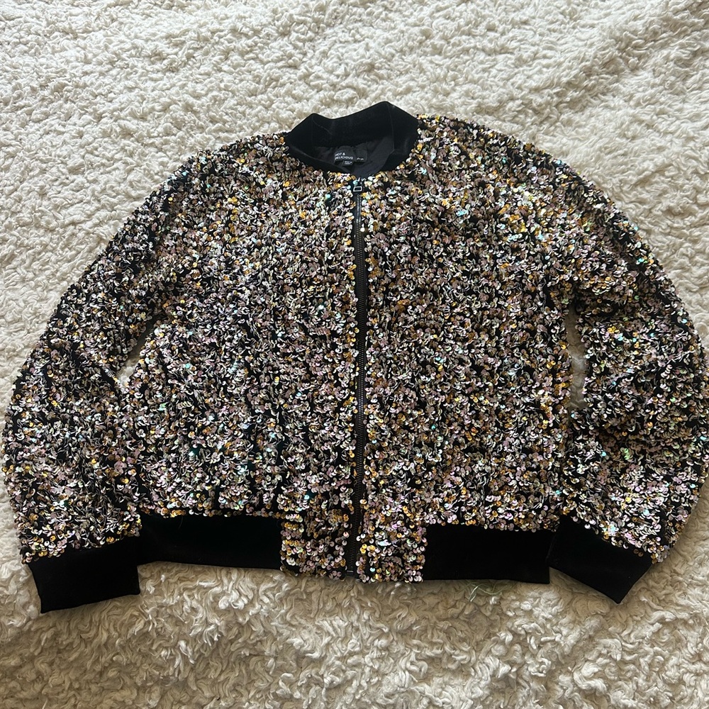 Glitter zip up jacket with velvet embellishments.